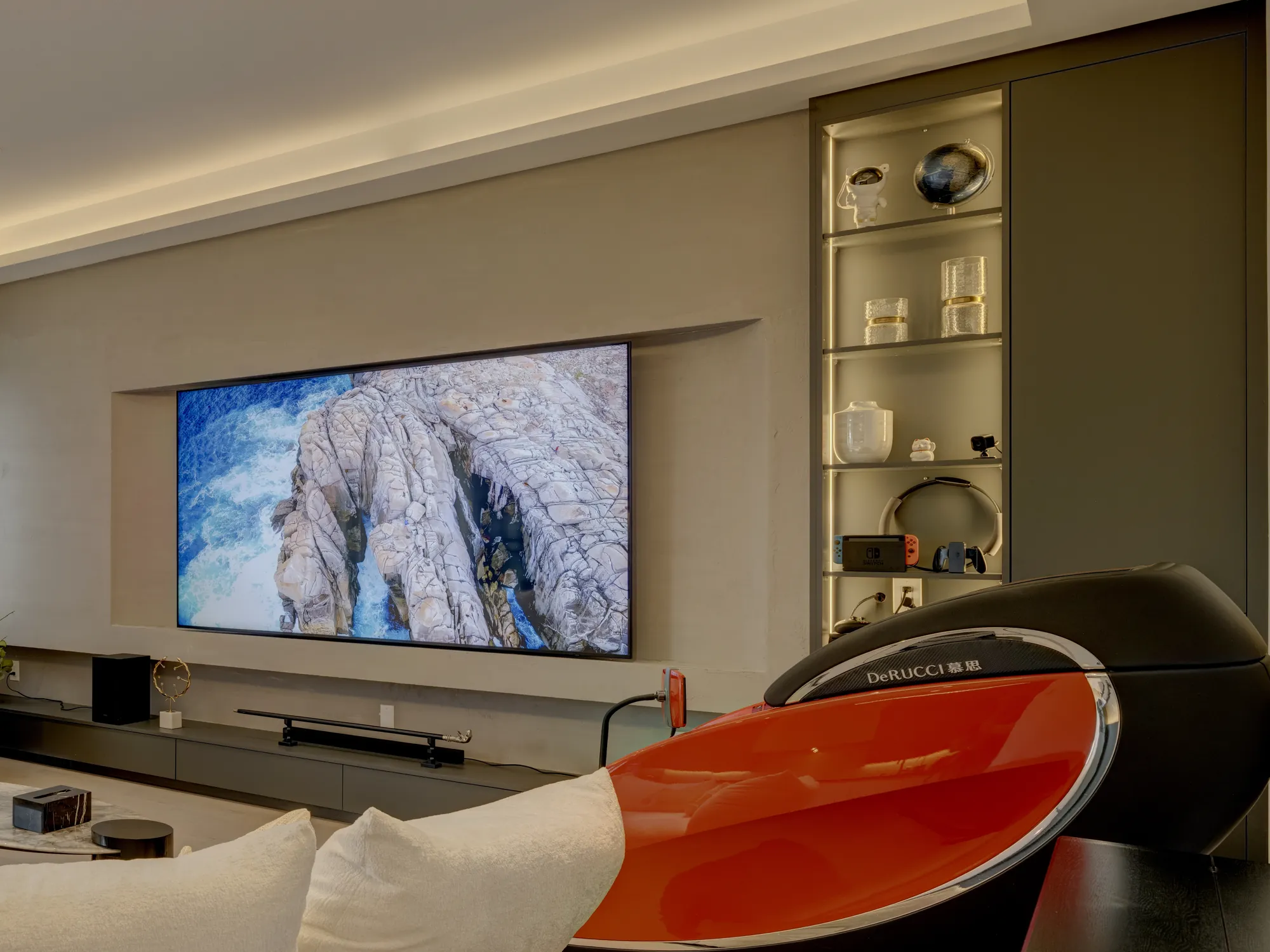 Built-in media wall with recessed TV niche and lit display cabinet in Richmond Hill