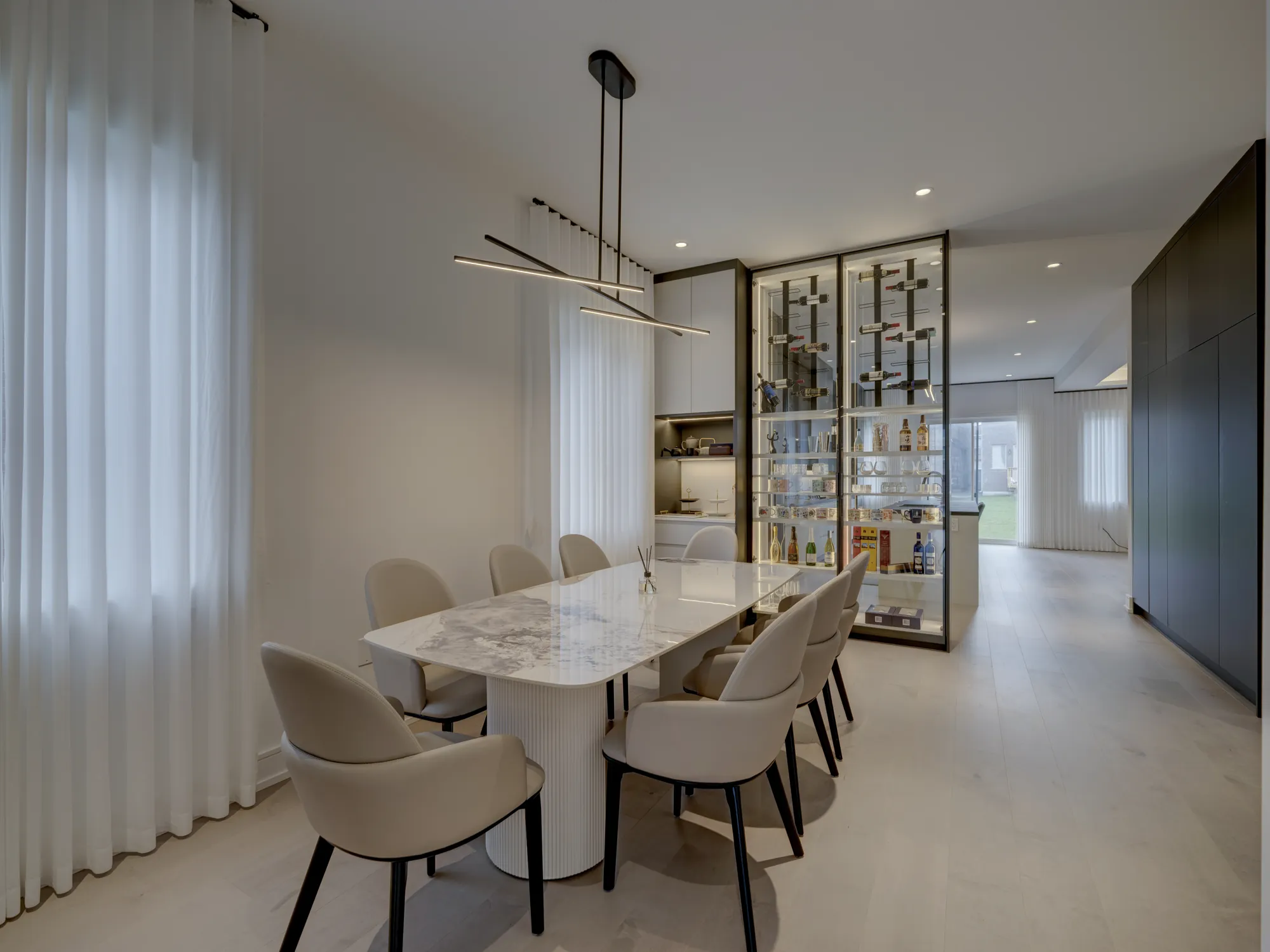 Full-height glass display cabinet beside a dining table in Richmond Hill
