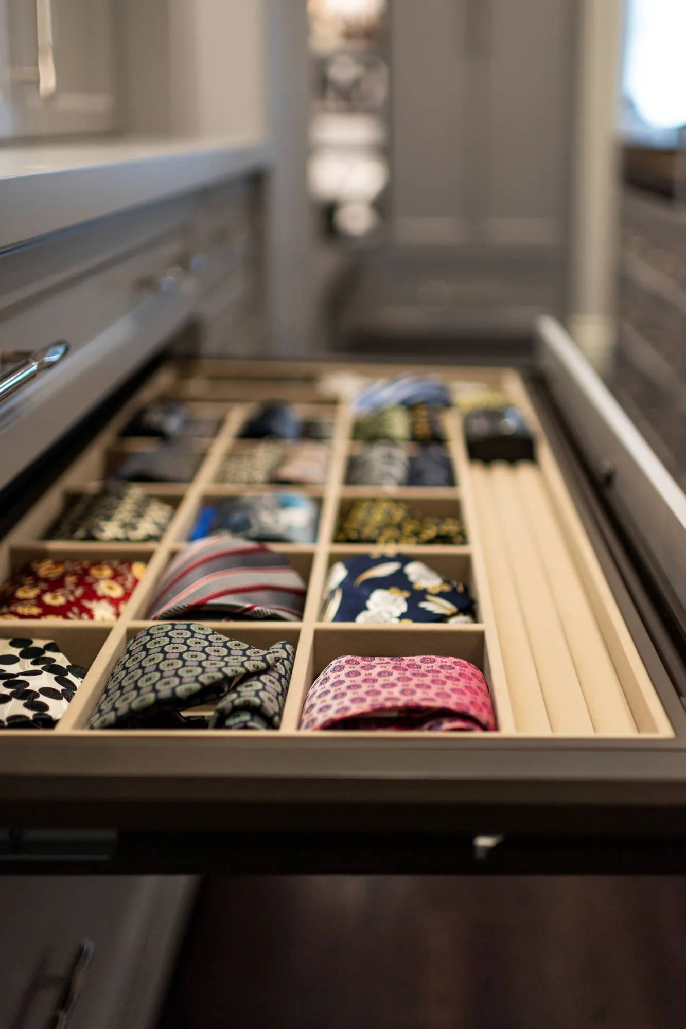 Divided accessory drawer holding ties in a Richmond Hill dressing room